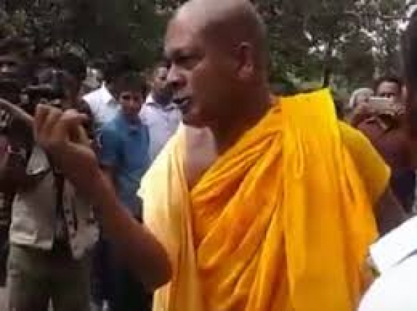 Controversial Monk Attempts To Assault Chenkalady Divisional Secretary For Trying To Cut Bo Tree Obstructing Electricity Line [VIDEO]